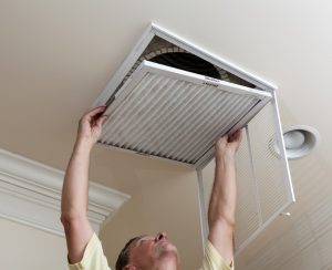 technician-changing-filter-vent