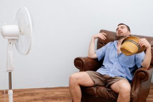 man-in-front-of-fan